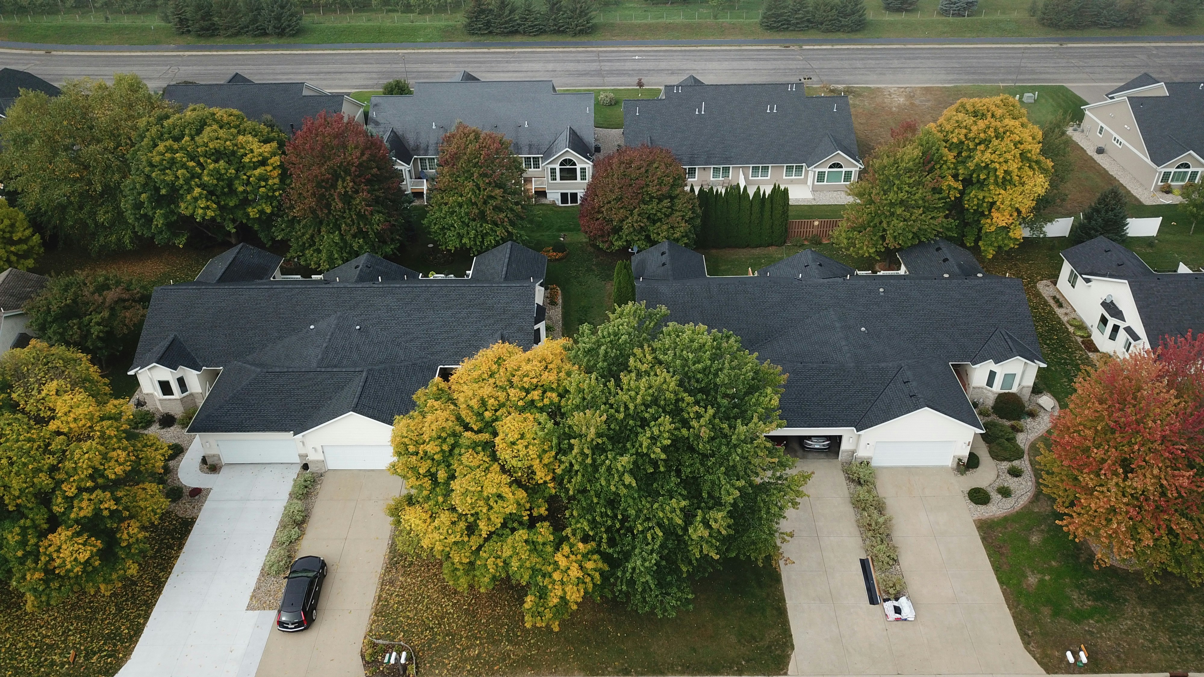 Professional roofers installing shingles